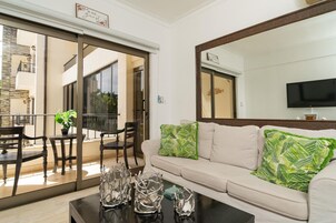 Deluxe Condo, 2 Bedrooms, Pool View | Living area | TV