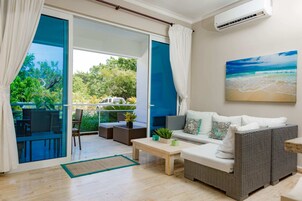 Premium Condo, 1 Bedroom, Partial Sea View | Living area | TV