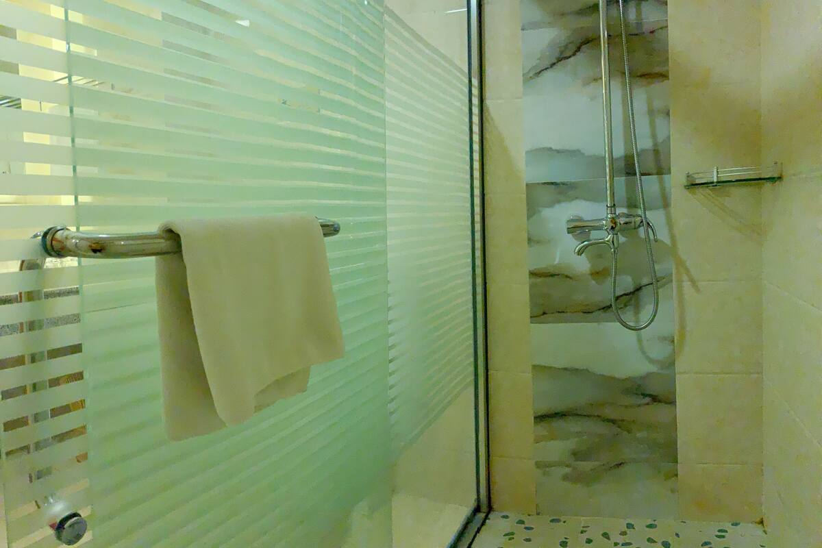 deluxe double room | bathroom | shower, rainfall showerhead, designer toiletries, hair dryer