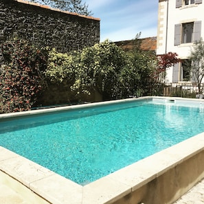Seasonal outdoor pool, open 9:30 AM to 8:30 PM, pool loungers