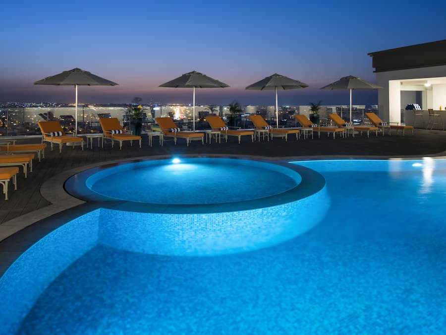 Outdoor pool, pool umbrellas, sun loungers