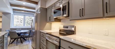 Condo, 2 Bedrooms | Private kitchen | Microwave, dishwasher, cookware/dishes/utensils