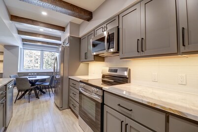 Peaceful Forested Location Next to River, Ski-In Ski-Out Located in Center Village - LD102 by Redawning