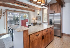 Condo, 2 Bedrooms | Private kitchen | Microwave, dishwasher, cookware/dishes/utensils, dining tables