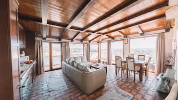 Deluxe Apartment, 2 Bedrooms, Balcony | Living area | LCD TV, stereo
