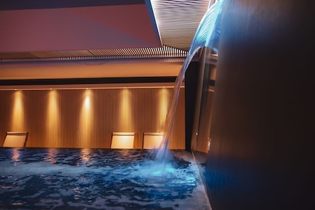 Pool waterfall. Moma Hotel
