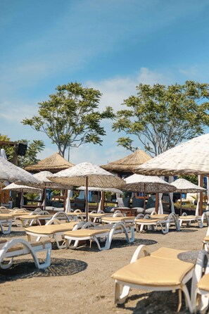 Plage privée, navette gratuite vers la plage, cabines gratuites