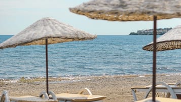 Private beach, free beach shuttle, free beach cabanas, sun loungers