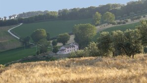 A rural landscape with a house surrounded by fields and trees. - La Quercia del Saggio (Senigallia)
