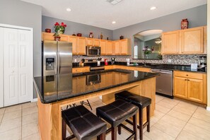 Family Villa, Multiple Bedrooms, Garden Area | Shared kitchen | Fridge, microwave, oven - Emerald Island #2 - 7 Bed 5 Baths Villa (Kissimmee)