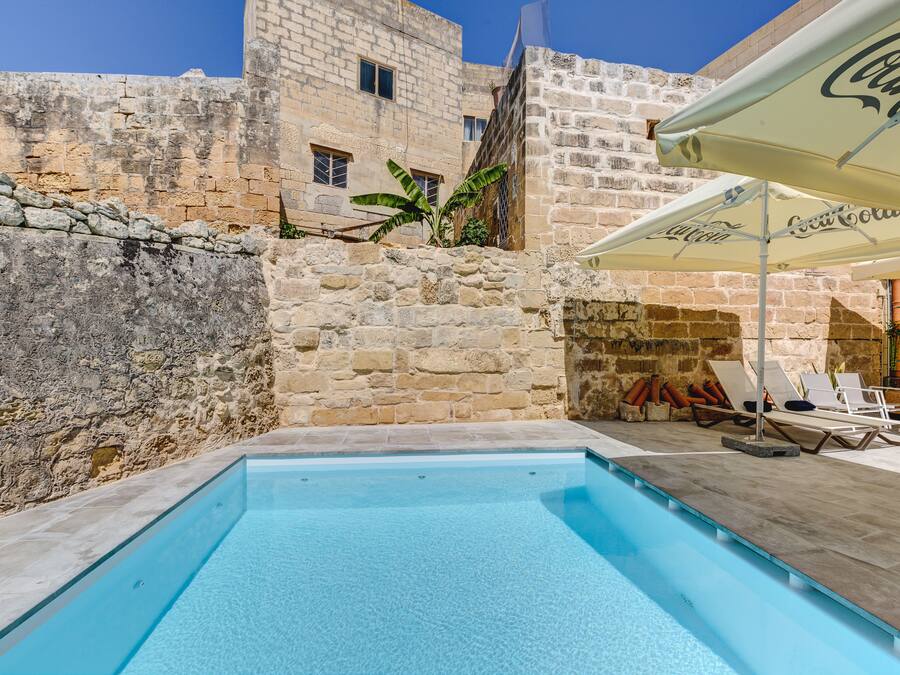 Outdoor pool, pool umbrellas, pool loungers