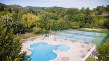Seasonal outdoor pool, a heated pool, pool umbrellas, pool loungers