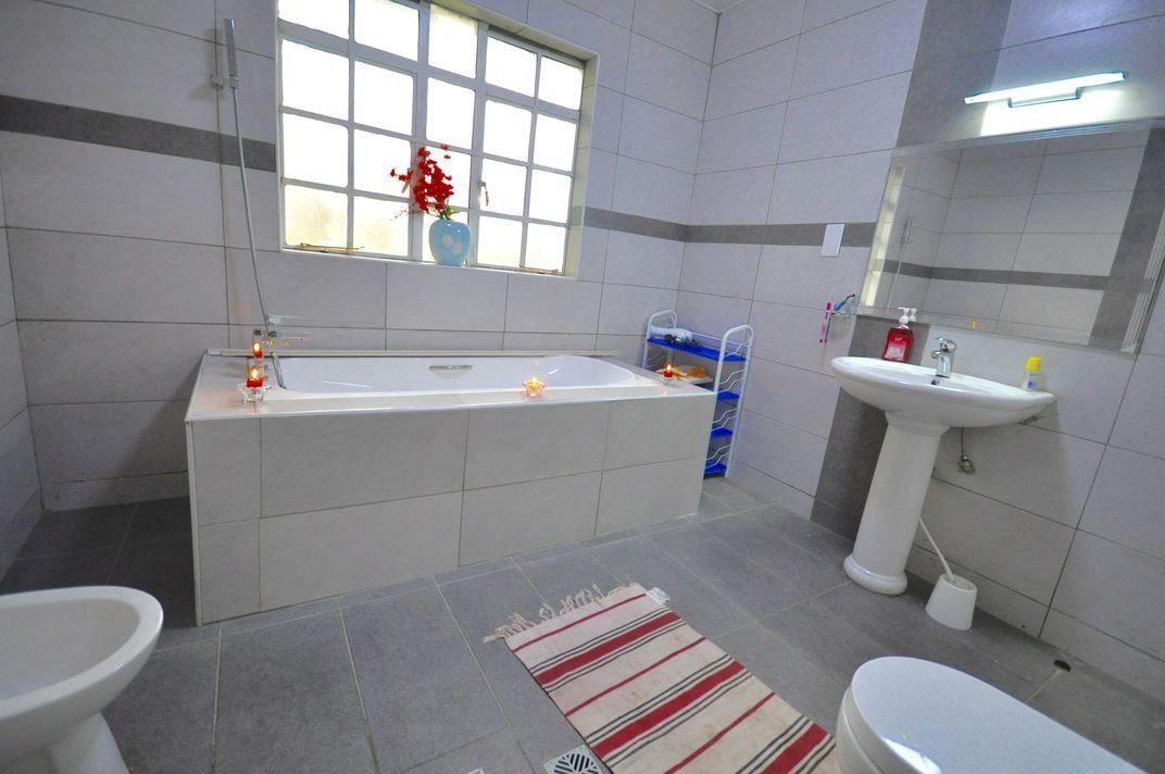 Apartment, 3 Bedrooms | Bathroom | Shower, rainfall showerhead, hair dryer, slippers