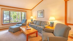 A cozy living room with a sofa, chairs, a coffee table, and lamps. - Blue Heron Holidays (Union)
