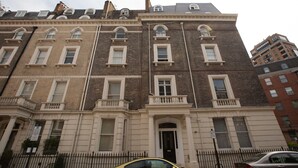 A multi-story building with a classic architectural style, featuring a symmetrical facade with evenly spaced windows and a central entrance. - Emperors Gate Residence by Allô Housing (London)