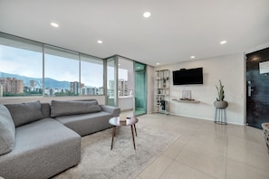 Apartment, 3 Bedrooms, Terrace (1202) | Living area | 40-inch flat-screen TV with cable channels, TV - Apartamentos Poblado Alejandría by HOUSY HOST (Medellín)