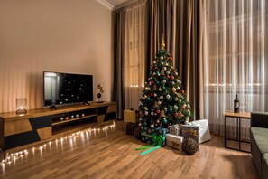 Deluxe Apartment, 1 Bedroom | Living area | TV