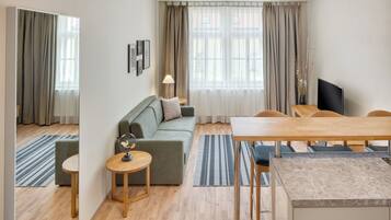 Deluxe Apartment, 1 Bedroom | Living area | TV