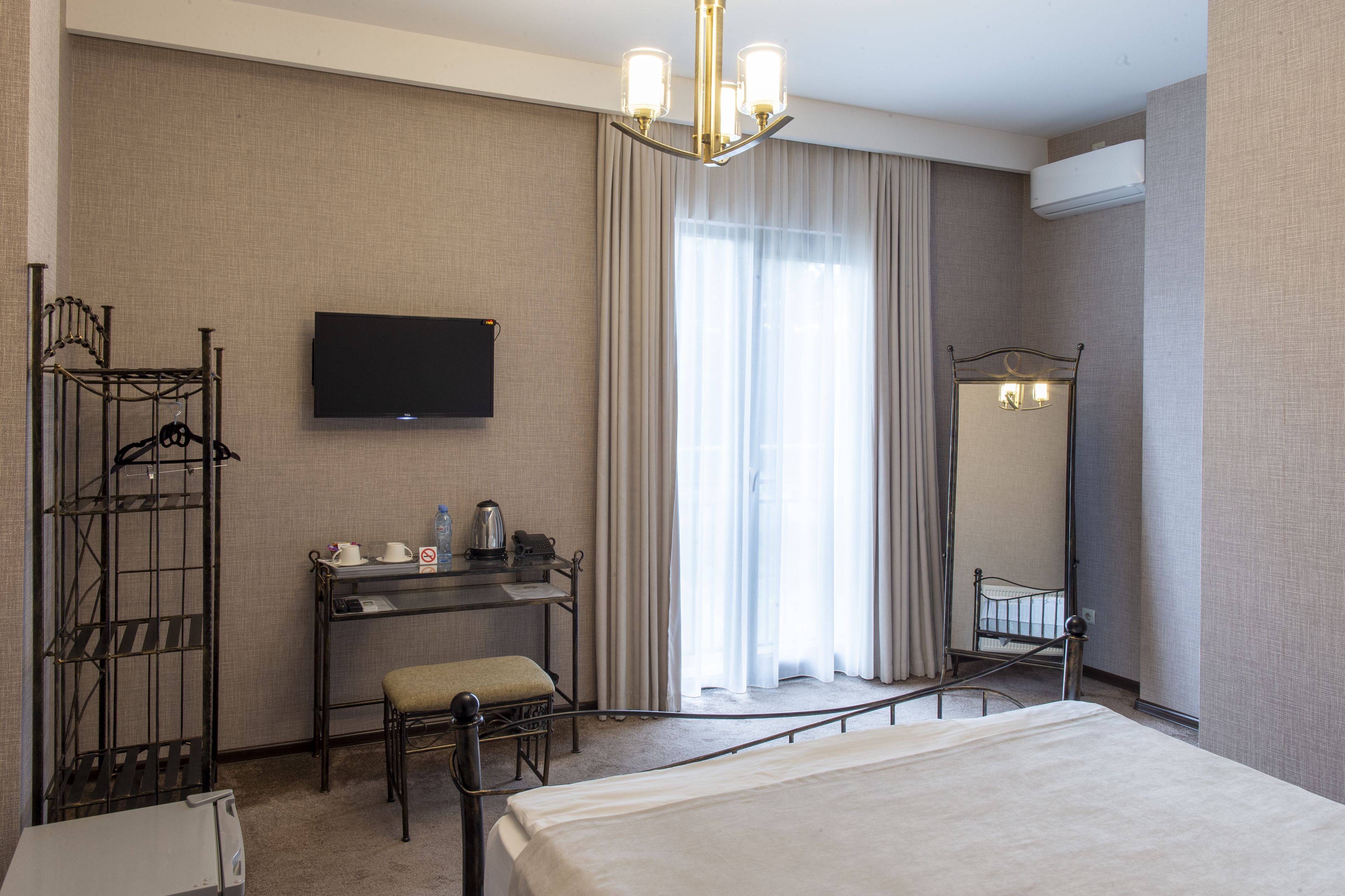 classic double room, 1 bedroom | living area | flat-screen tv, heated floors