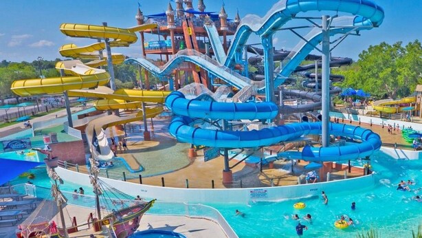 A water park with multiple slides and pools. - Good Times & Tan Lines WWi201 Apartment 2 New (New Braunfels)