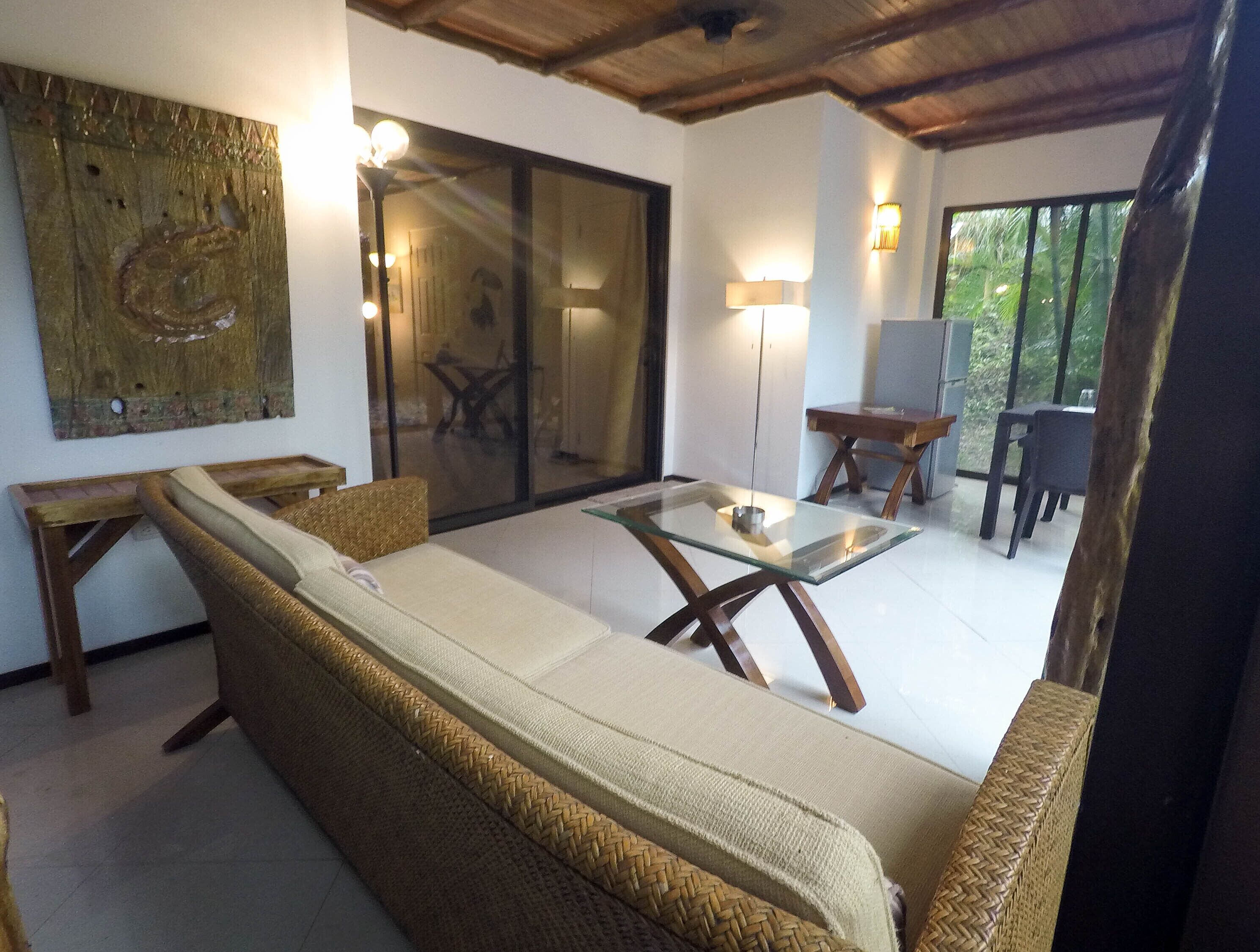 premium bungalow, 1 king bed, non smoking, mountain view | living area