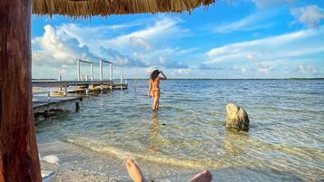 Private beach, white sand, sun loungers, beach towels