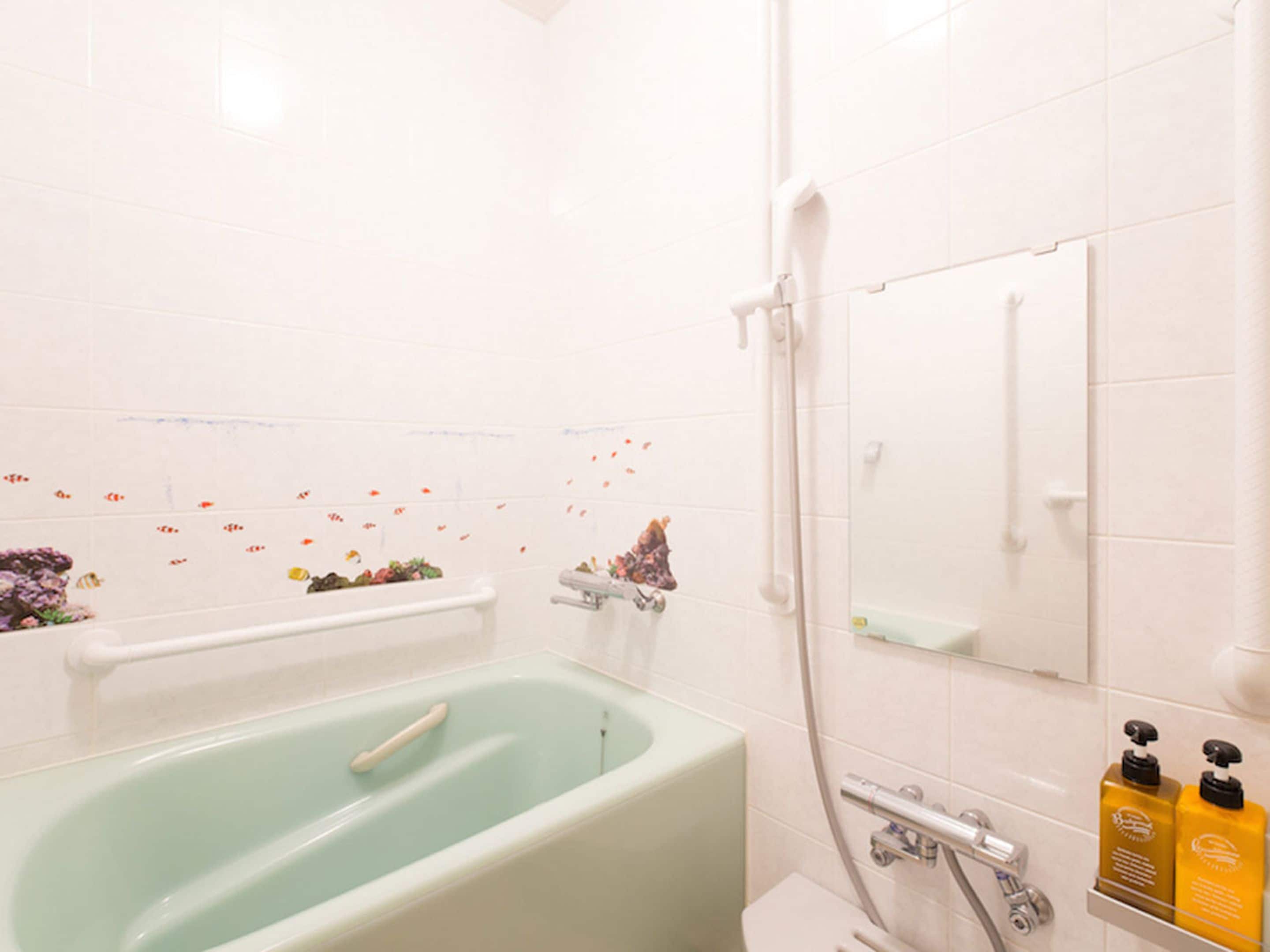 twin room | bathroom | separate bathtub and shower, deep-soaking bathtub, free toiletries