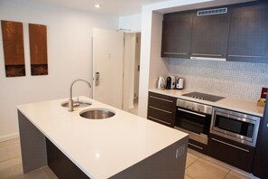 Luxury Apartment, 2 Bedrooms, Pool View, Poolside | Private kitchen | Full-sized fridge, microwave, oven, stovetop - 131 Luxury Swimout (Craiglie)