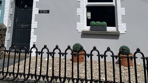 A two-story building with a black door and a sign reading "11 Seasalt Cottage." - Modernised traditional cottage, Sleeps 5,short walk to beaches, town, amenities  (Tenby)