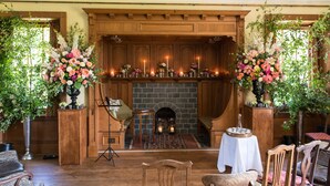 A cozy room with a fireplace, wooden furniture, and floral decorations. - Classically beautiful large family friendly retreat, situated on the Moray Firth (Moray)