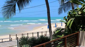 On the beach, sun-loungers