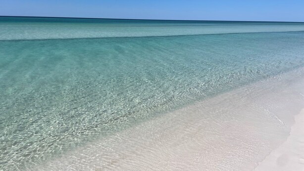 A beach with clear turquoise water and white sand. - Steps away from Camp Watercolor Amenities  (Santa Rosa Beach)