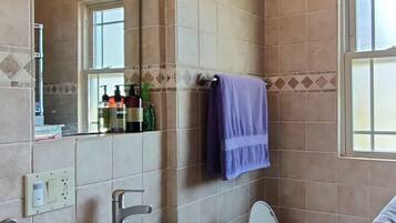 Shower, hair dryer, towels, soap