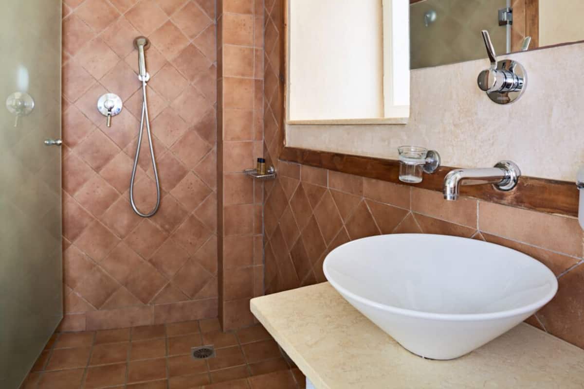 green bedroom, mezzanine studio | bathroom | shower, hair dryer, towels