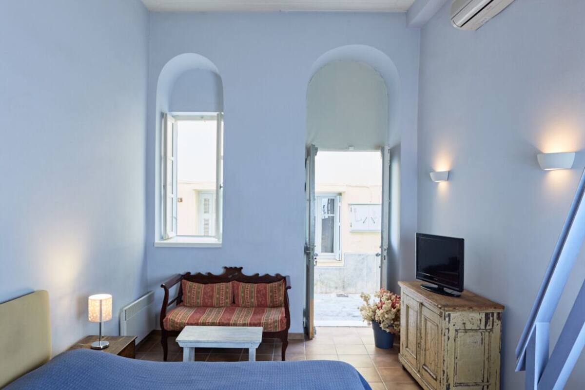 blue and yellow mezzanine studio | minibar, in-room safe, desk, soundproofing