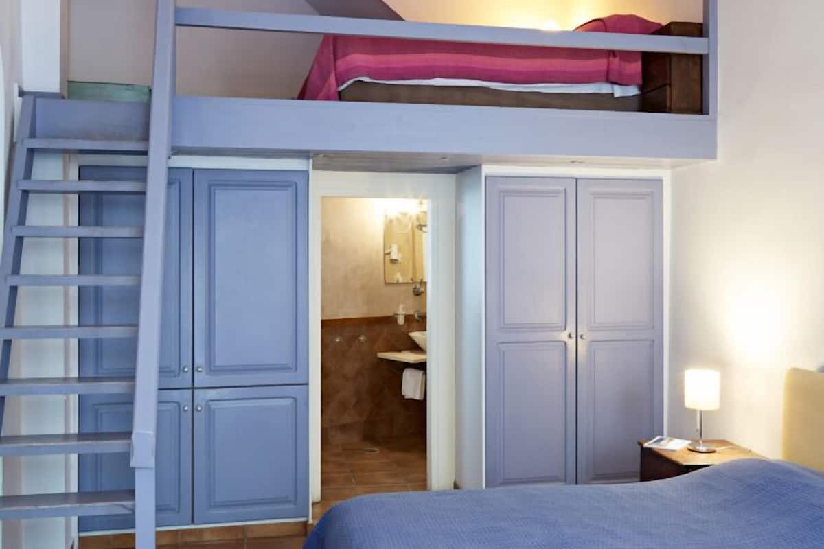 blue and yellow mezzanine studio | minibar, in-room safe, desk, soundproofing