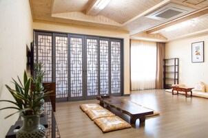 Woori Family Room | Down comforters, in-room safe, desk, blackout drapes