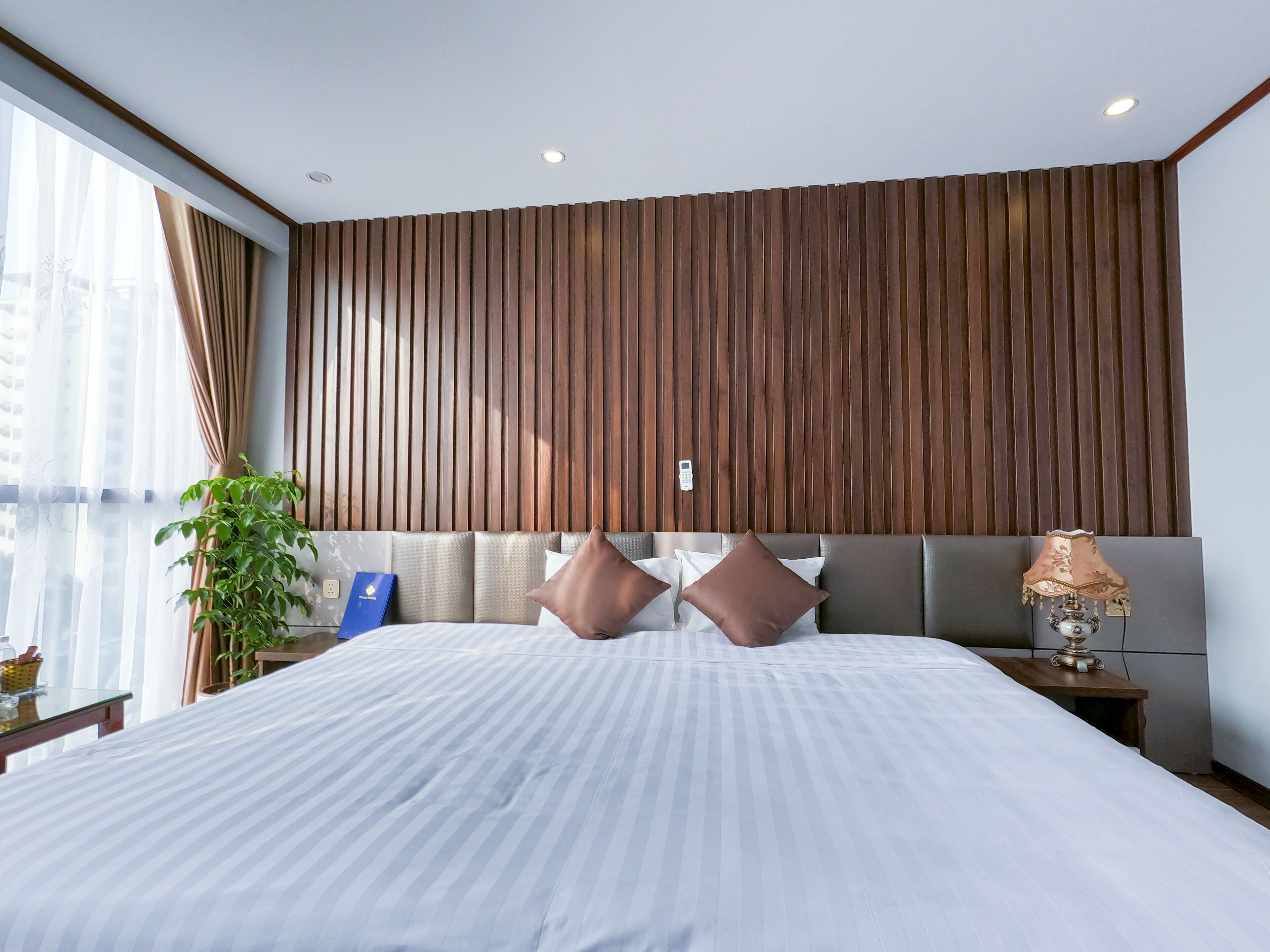 deluxe room | minibar, desk, laptop workspace, blackout curtains