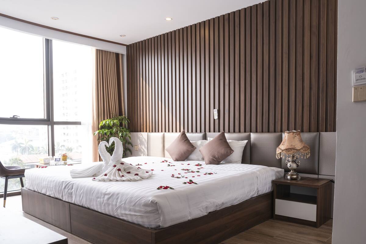 deluxe room | minibar, desk, laptop workspace, blackout curtains