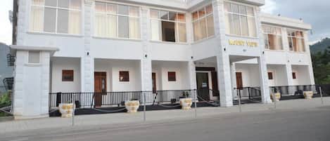 A two-story building with a sign reading "Mount View".