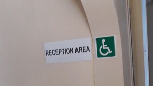 A reception area with a sign indicating it is a reception area and a wheelchair accessibility symbol. - Diphororo Guest House (Moses Kotane)