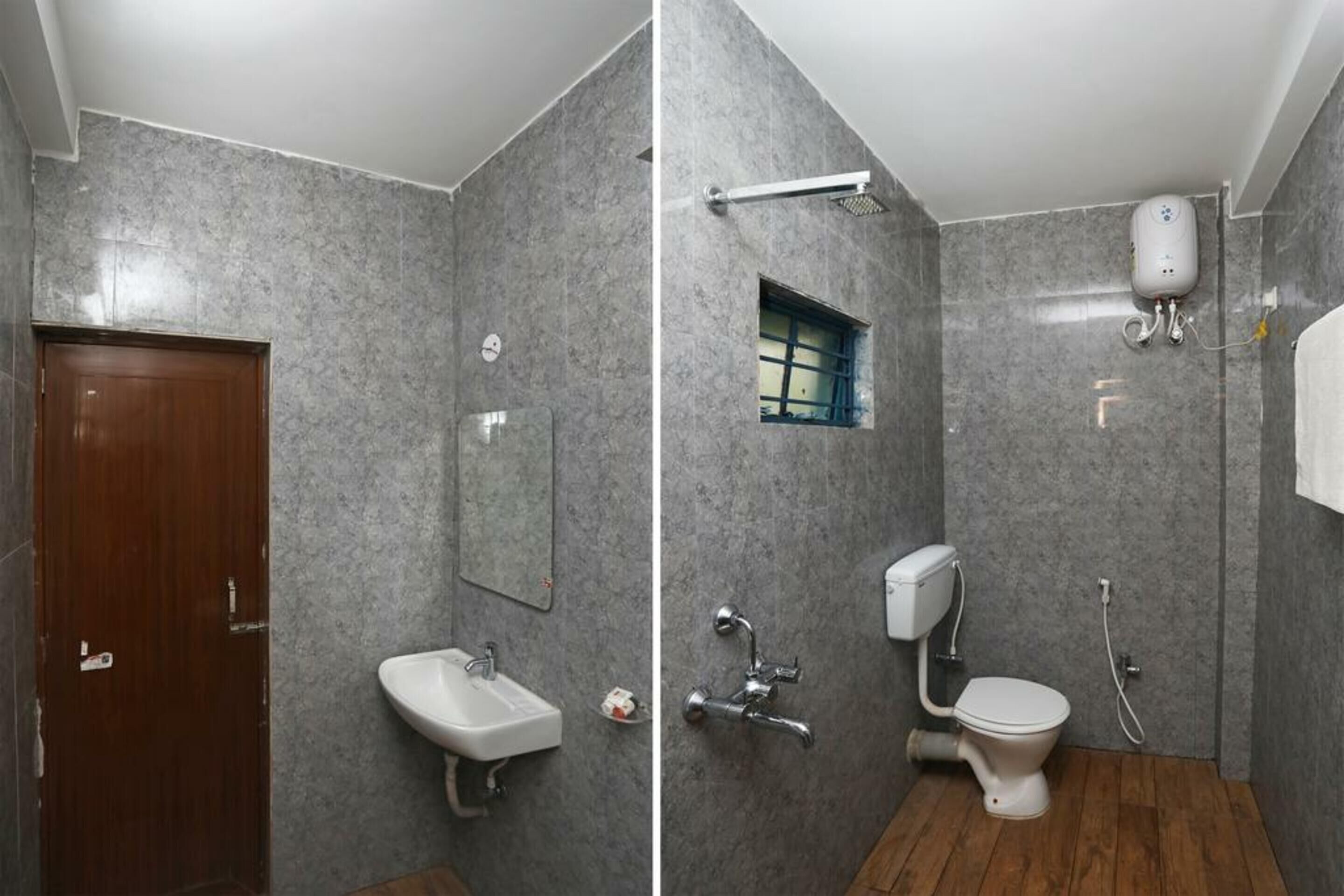 A bathroom with a wooden door, a sink, a mirror, a shower, and a toilet.