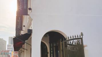 The exterior of the Macallum Central Hotel with a prominent entrance and signage.