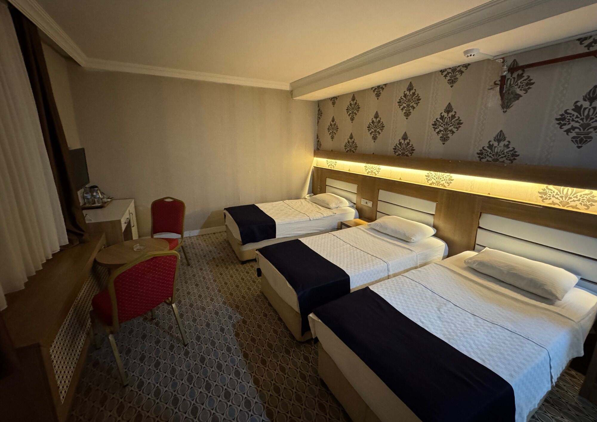 Standard Triple Room | Minibar, in-room safe, desk, laptop workspace