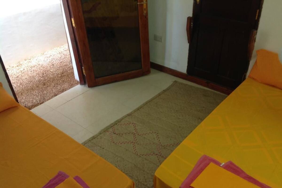 Basic Twin Room, 2 Single Beds, Private Bathroom, Courtyard Area | Desk, iron/ironing board, free WiFi, individually decorated