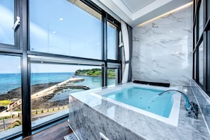 Separate bathtub and shower, jetted bath, designer toiletries