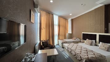 Quarto triplo standard | 1 quarto, frigobar, cofres nos quartos, escrivaninha