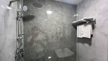 Shower, designer toiletries, hair dryer, slippers