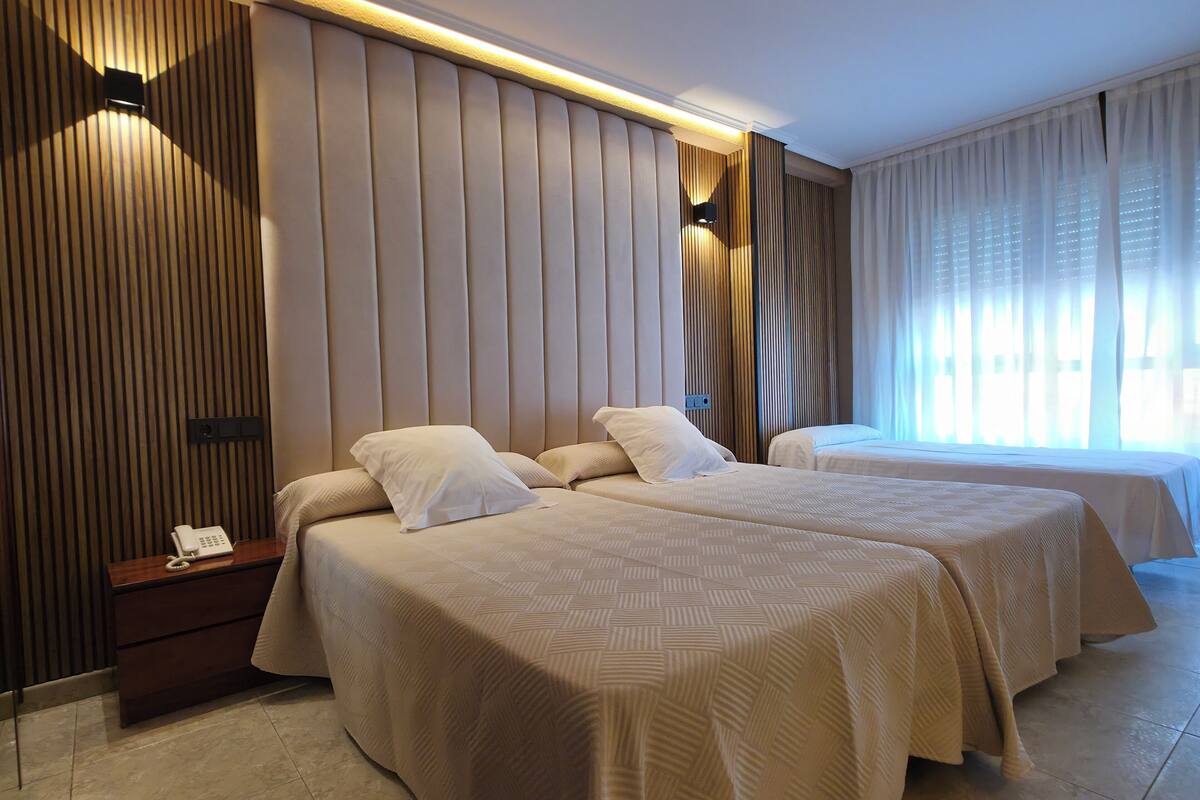 triple room (2 adults, 1 child) | in-room safe, desk, free wifi, bed sheets