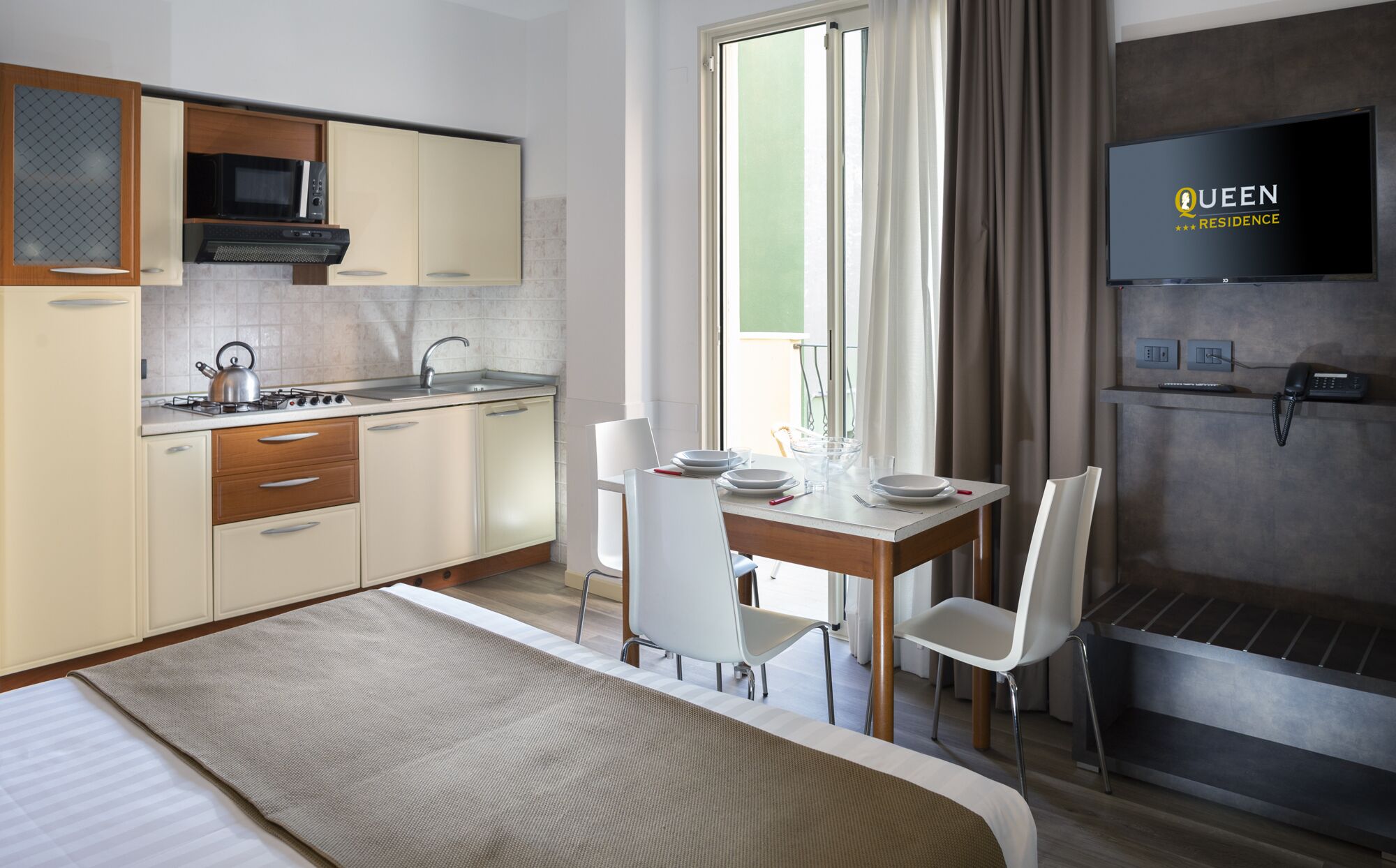 comfort studio, balcony | private kitchenette | full-sized fridge, microwave, stovetop, cookware/dishes/utensils